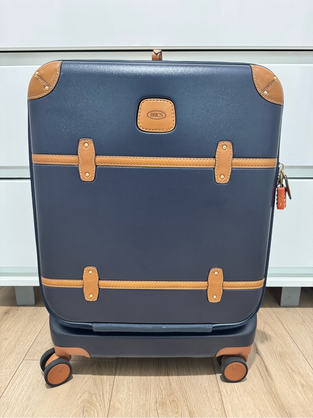Bric's Navy with Tan Trim Upright Spinner Carry-On